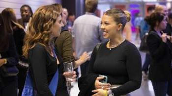 Two woman engaged in conversation 